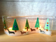 Load image into Gallery viewer, Set of 3 Fused Glass Christmas Tree Candle Screens featuring dachshunds walking in the snow.
